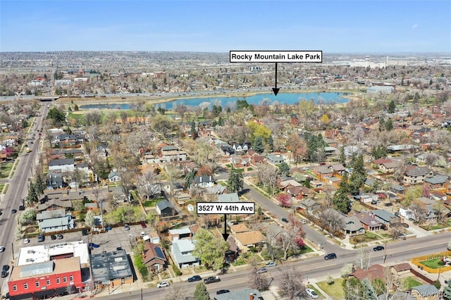 bird's eye view with a water view and a residential view
