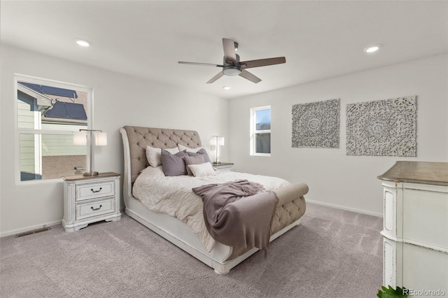 carpeted bedroom with ceiling fan