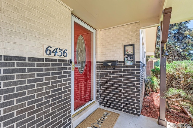 6436 Otis St, Arvada, CO 80003 - doorway to property with brick siding