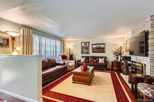6436 Otis St, Arvada, CO 80003 - living area featuring a textured ceiling