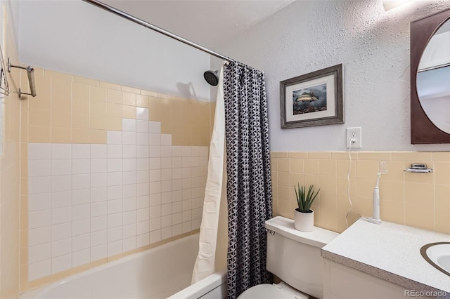 6436 Otis St, Arvada, CO 80003 - full bath with shower / tub combo, vanity, and tile walls
