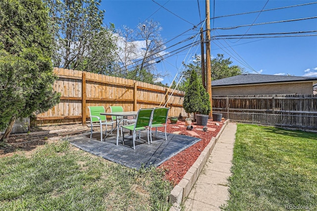 6436 Otis St, Arvada, CO 80003 - fenced backyard featuring a patio area