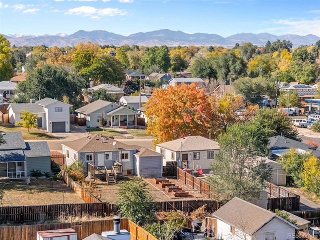 birds eye view of property with a mountain view