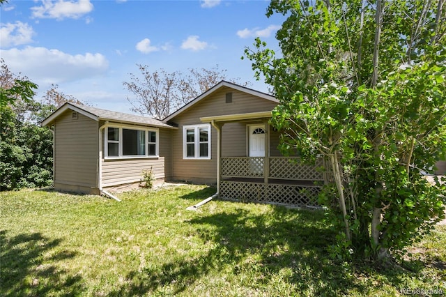 180 S Lamar St, Lakewood, CO 80226 - view of front facade with a front yard and covered porch