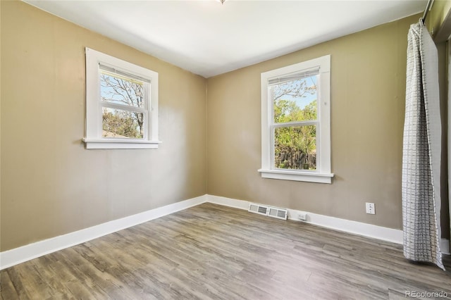 180 S Lamar St, Lakewood, CO 80226 - unfurnished room with wood finished floors and baseboards