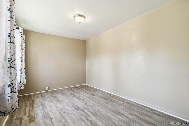 180 S Lamar St, Lakewood, CO 80226 - empty room with wood finished floors and baseboards