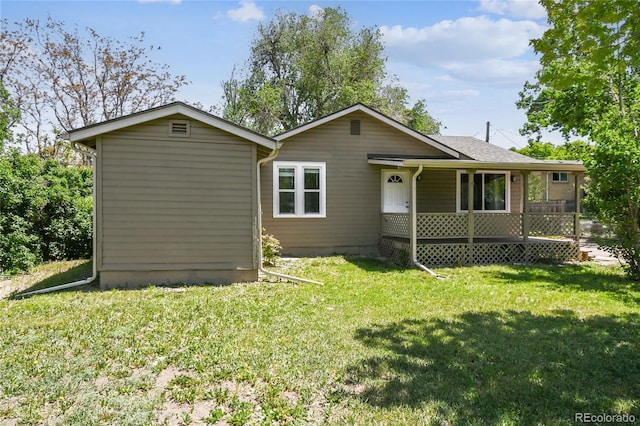 180 S Lamar St, Lakewood, CO 80226 - back of property with a lawn and a porch