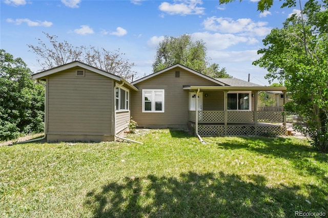 180 S Lamar St, Lakewood, CO 80226 - rear view of property featuring a yard