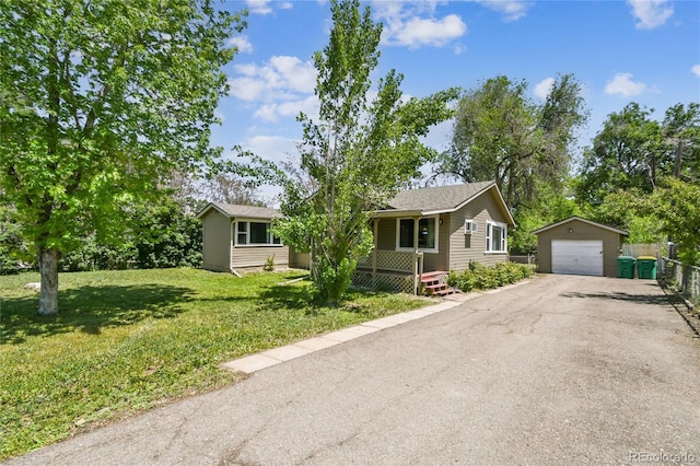 180 S Lamar St, Lakewood, CO 80226 - single story home featuring an outdoor structure, a garage, and asphalt driveway