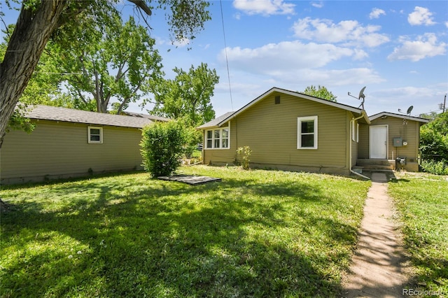 180 S Lamar St, Lakewood, CO 80226 - rear view of house featuring a yard