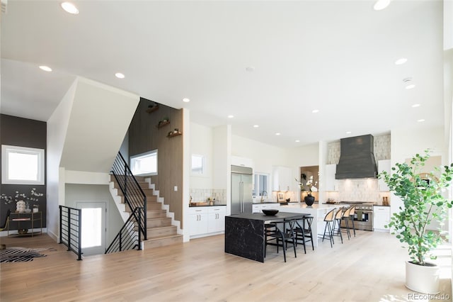 8230 W Tennessee Ct, Lakewood, CO 80226 - dining room with stairway, light wood finished floors, and recessed lighting
