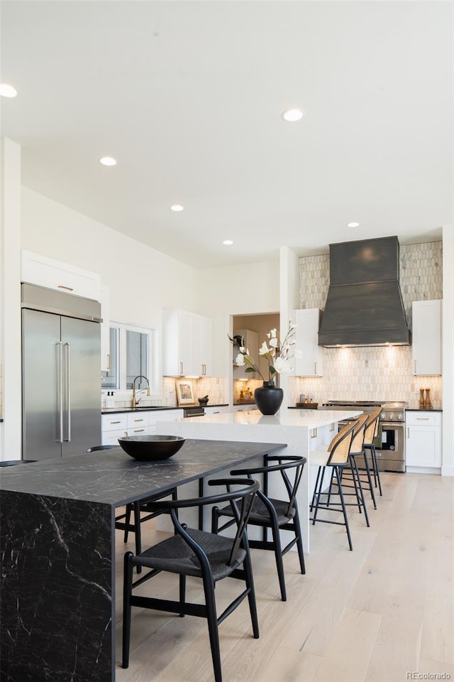 8230 W Tennessee Ct, Lakewood, CO 80226 - dining area featuring light wood-style flooring and recessed lighting