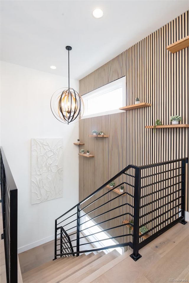 8230 W Tennessee Ct, Lakewood, CO 80226 - stairway with baseboards, a chandelier, wood finished floors, and recessed lighting