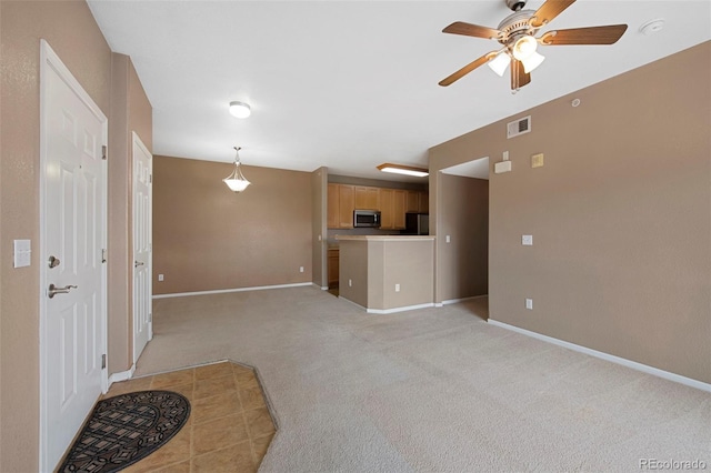15700 E Jamison Dr Unit 3-307, Englewood, CO 80112 - unfurnished living room with light carpet, a ceiling fan, and baseboards