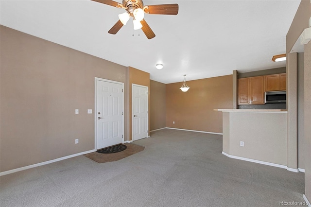 15700 E Jamison Dr Unit 3-307, Englewood, CO 80112 - unfurnished living room with carpet flooring, baseboards, and a ceiling fan