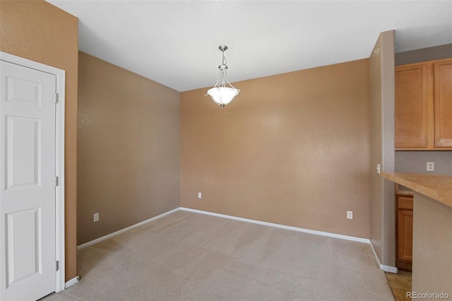 15700 E Jamison Dr Unit 3-307, Englewood, CO 80112 - unfurnished dining area featuring light colored carpet and baseboards