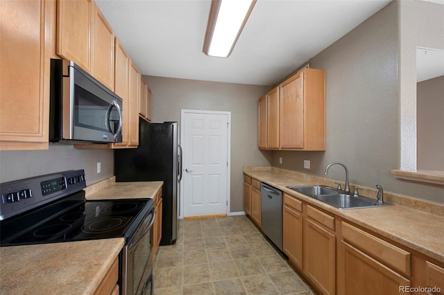 15700 E Jamison Dr Unit 3-307, Englewood, CO 80112 - kitchen featuring stainless steel appliances, a sink, light brown cabinetry, and light countertops