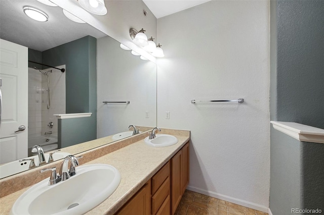 15700 E Jamison Dr Unit 3-307, Englewood, CO 80112 - bathroom featuring baseboards, double vanity, and shower / tub combination