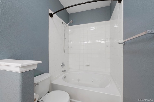15700 E Jamison Dr Unit 3-307, Englewood, CO 80112 - bathroom with a textured wall, toilet, and a combined bath / shower with jetted tub