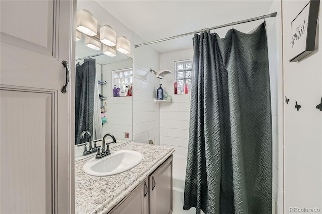 bathroom with a shower with curtain and vanity