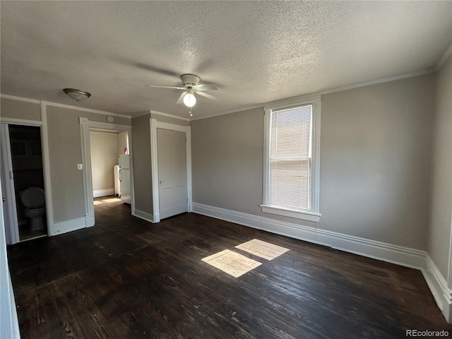 501 N Weber, Colorado Springs, CO 80903 - unfurnished bedroom with a textured ceiling, dark wood finished floors, baseboards, a closet, and ornamental molding