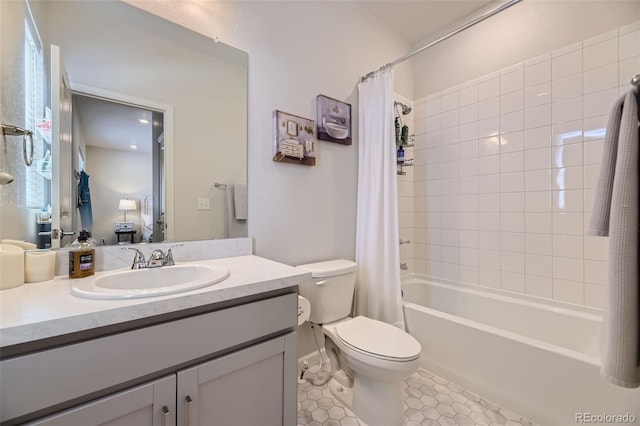 full bathroom with vanity, shower / bath combo with shower curtain, tile patterned flooring, and toilet