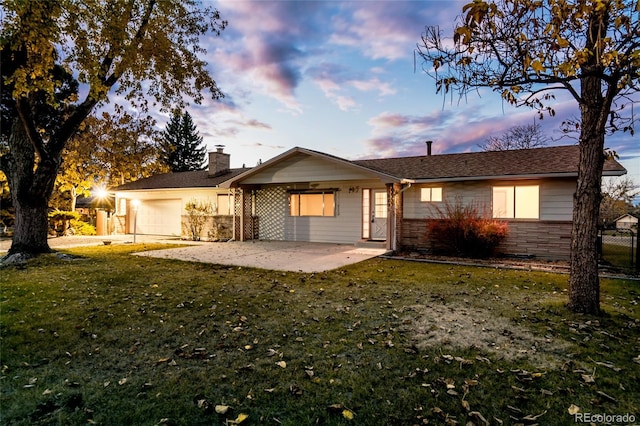 8895 Morton Rd, Niwot, CO 80503 - view of front of house featuring a garage and a chimney