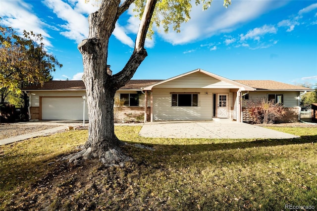 8895 Morton Rd, Niwot, CO 80503 - single story home featuring a garage, a front yard, and driveway