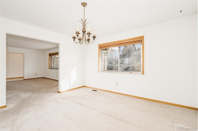 8895 Morton Rd, Niwot, CO 80503 - spare room featuring a chandelier and light colored carpet