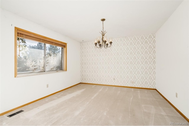 8895 Morton Rd, Niwot, CO 80503 - spare room featuring wallpapered walls, a chandelier, light colored carpet, and an accent wall