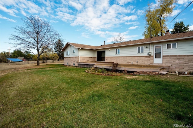 8895 Morton Rd, Niwot, CO 80503 - rear view of property with a yard and a deck