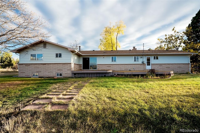 8895 Morton Rd, Niwot, CO 80503 - rear view of house featuring a yard and stone siding