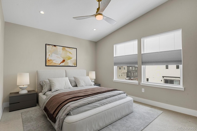 bedroom featuring ceiling fan, light carpet, and lofted ceiling