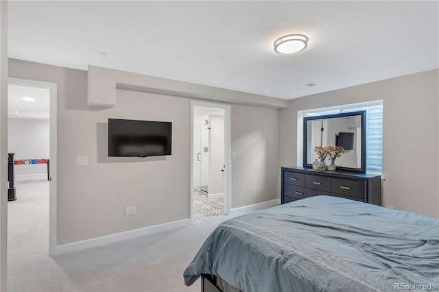 bedroom with a textured ceiling and light carpet