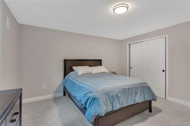 carpeted bedroom with a closet