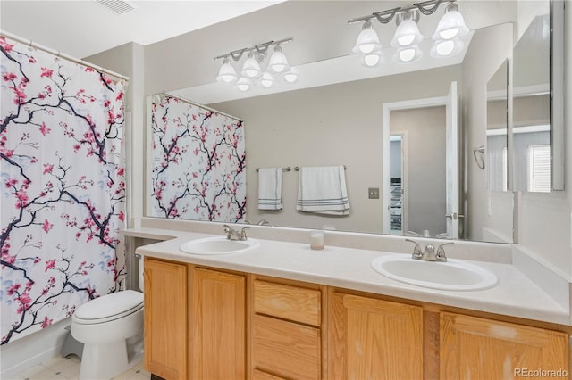 full bathroom with tile patterned flooring, vanity, toilet, and shower / tub combo with curtain