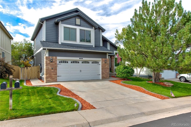 craftsman-style house featuring a front lawn and a garage