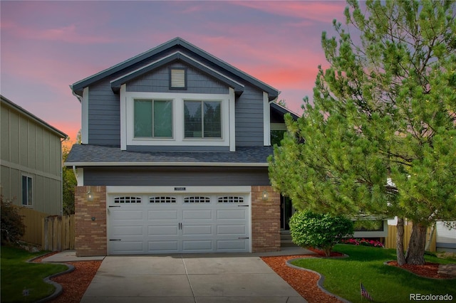 craftsman inspired home featuring a yard and a garage