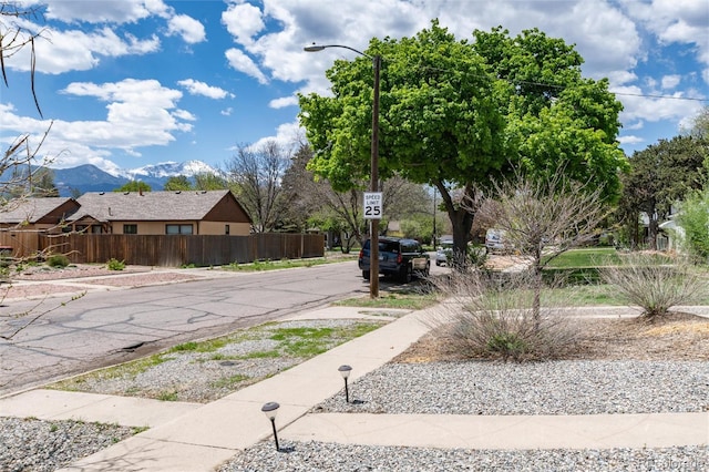 916 E Ln Salle St, Colorado Springs, CO 80907 - view of asphalt street featuring sidewalks, traffic signs, street lighting, and a mountain view