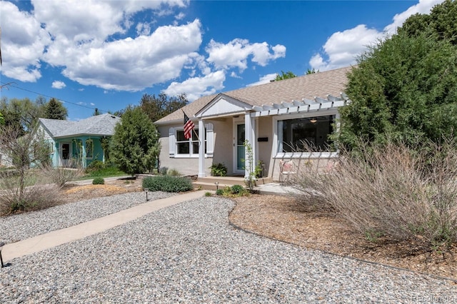 916 E Ln Salle St, Colorado Springs, CO 80907 - view of front facade featuring stucco siding and a pergola