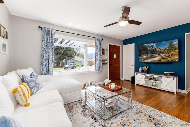 916 E Ln Salle St, Colorado Springs, CO 80907 - living area with wood finished floors, ceiling fan, and baseboards