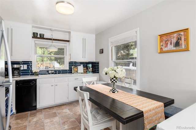 916 E Ln Salle St, Colorado Springs, CO 80907 - kitchen featuring dishwasher, light countertops, tasteful backsplash, white cabinetry, and light stone finish floors