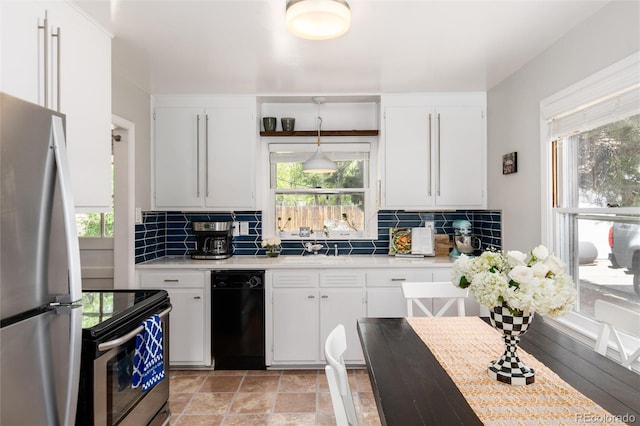 916 E Ln Salle St, Colorado Springs, CO 80907 - kitchen with appliances with stainless steel finishes, light countertops, backsplash, and white cabinets