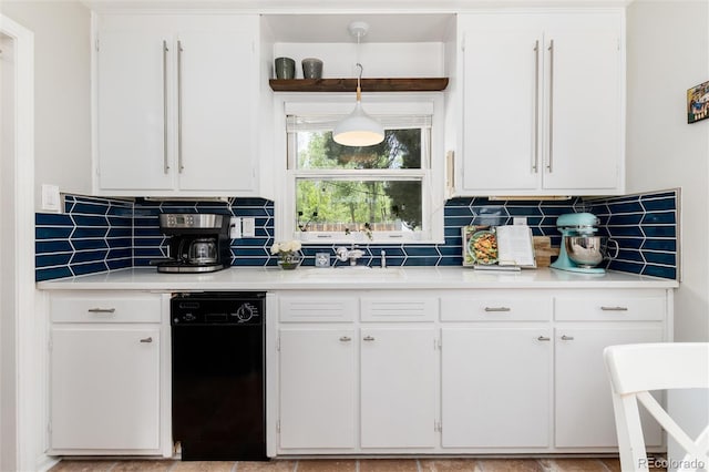 916 E Ln Salle St, Colorado Springs, CO 80907 - kitchen with dishwasher, a sink, light countertops, and white cabinets