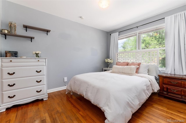 916 E Ln Salle St, Colorado Springs, CO 80907 - bedroom featuring light wood-style flooring and baseboards