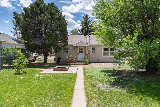 916 E Ln Salle St, Colorado Springs, CO 80907 - rear view of property featuring a deck, stucco siding, and a patio area