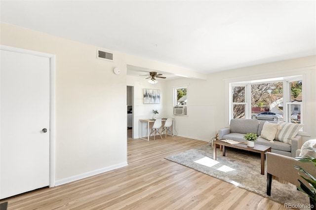 living room with light hardwood / wood-style flooring, cooling unit, and ceiling fan