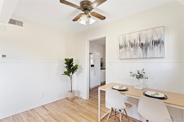 office space with light hardwood / wood-style floors and ceiling fan