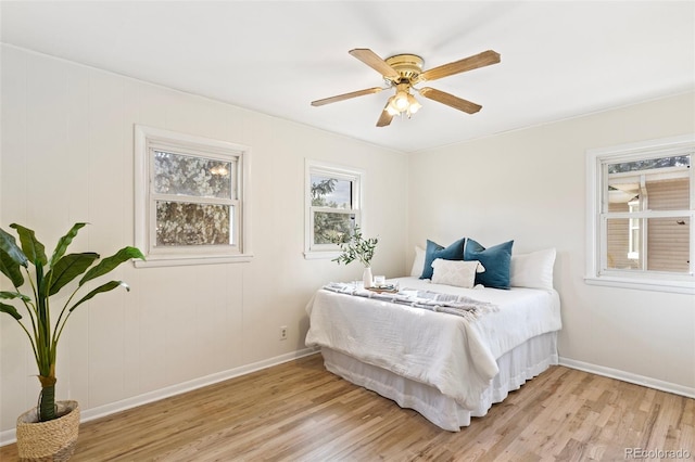 bedroom featuring light hardwood / wood-style flooring and ceiling fan