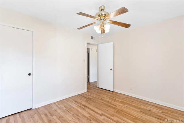 unfurnished bedroom featuring ceiling fan and light wood-type flooring